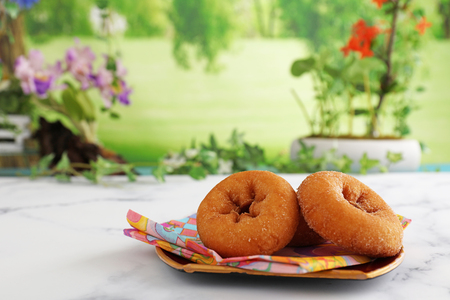 Handmade delicious doughnuts on the plateの写真素材