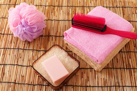 Bath and shower products on a bamboo matの写真素材