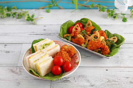 Tasty sandwiches and salad on the tableの写真素材