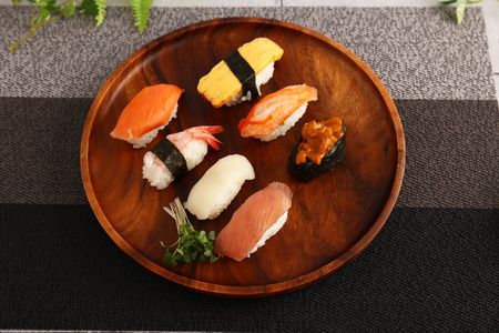 Delicious Japanese cuisine sushi on the wooden plateの写真素材