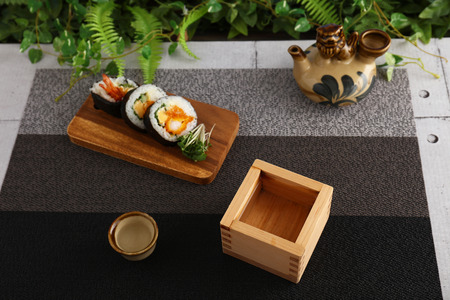 Japanese traditional cuisine Sake and sushi rollsの写真素材