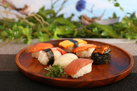 Delicious Japanese cuisine sushi on the wooden plateの写真素材