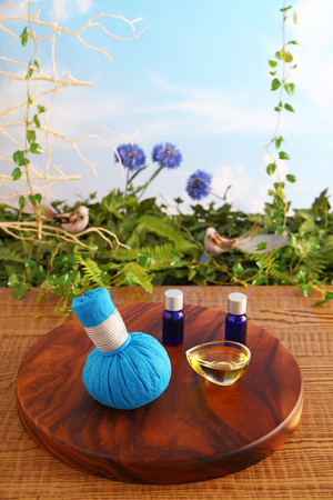 Herbal hot compress ball and essential oilsの写真素材