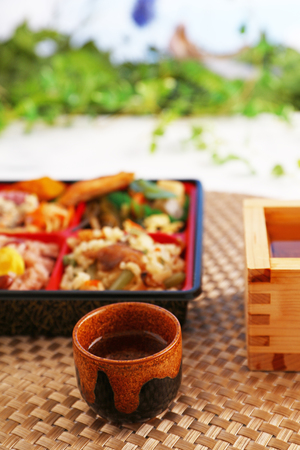 Delicious Japaneses and sake cuisine on the dining tableの写真素材