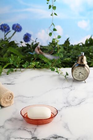 Bath and spa products with alarm clockの写真素材