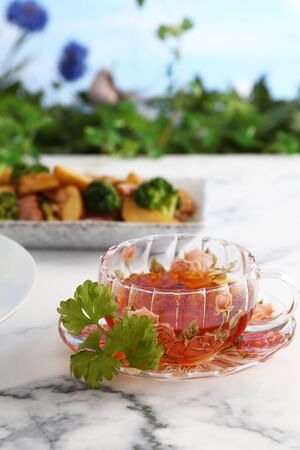 Delicious fried potatoes and a cup of teaの写真素材