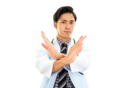Asian doctor shows the sign of prohibitionの写真素材