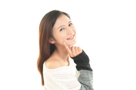 Smiling fashionable woman isolated on white background.の写真素材