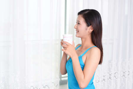 Portrait of an Asian woman at home.の写真素材