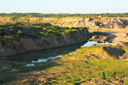 Top view of the sandy dolomite quarry in Belarus during the summer
