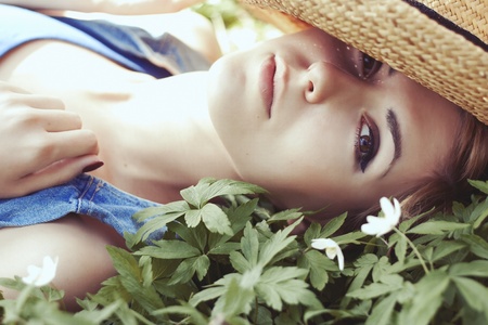 Girl with white flowers in summerの写真素材