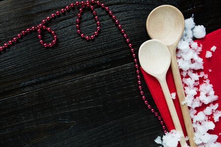 Wooden rustic spoons on Christmas backgroundの写真素材