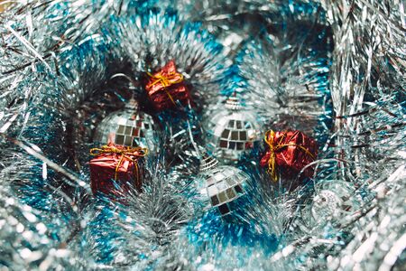 Silver Christmas balls on the tinsel backgroundの写真素材