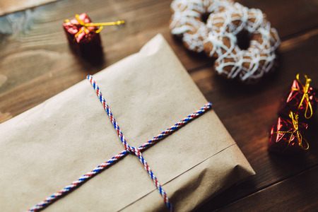 Craft envelope on the wooden table with New Year handmade toys and cookiesの写真素材