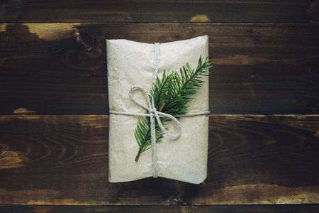 Wrapped gift with fur-tree branchの写真素材
