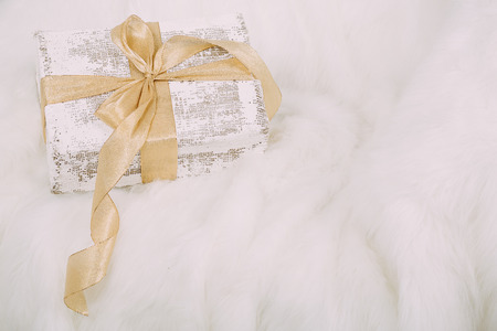 Beautiful Christmas gift on fluffy carpetの写真素材