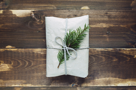 Wrapped gift with fur-tree branchの写真素材