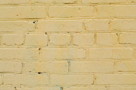 Yellow sloppy abstract  texture wall of buildingの写真素材
