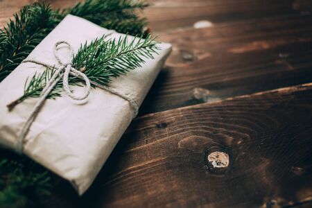 Wrapped gift with fur-tree branchの写真素材