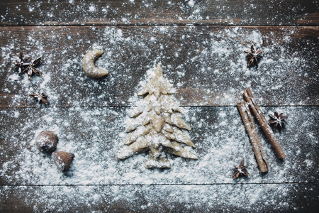 Christmas tree with flour on the wooden tableの写真素材
