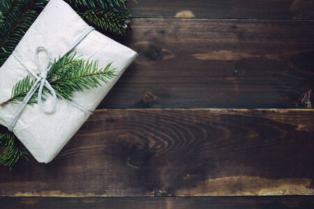 Wrapped gift with fur-tree branchの写真素材