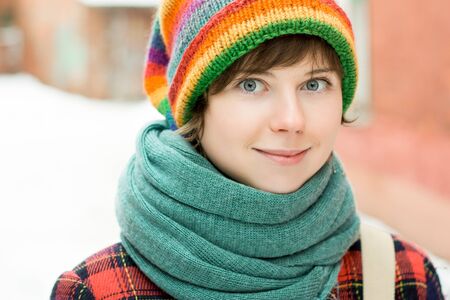 Beautiful woman in funny hat smiling and looking at cameraの写真素材