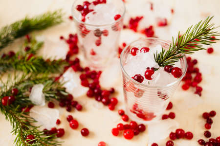 Frozen red berries on wooden white backroundの写真素材