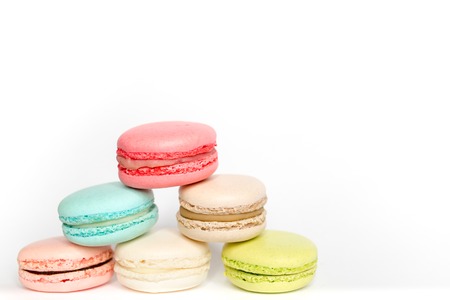 Colored Macarons on white background with copy spaceの写真素材