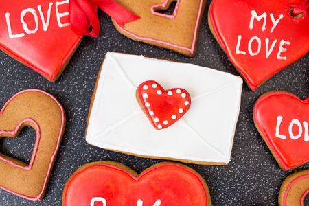 Valentine's day background with red heart cookiesの写真素材