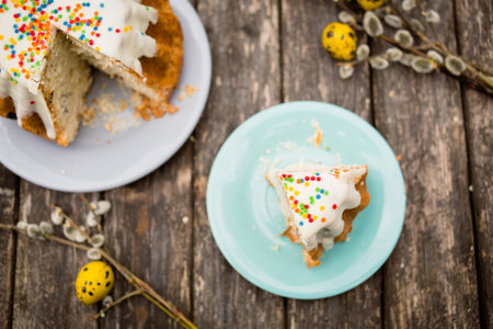 Sliced Easter cake and pussy-willows, copy space