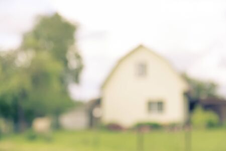 Blurred abstract countrified background with house outdoor in summer village, copy space, lens blurの写真素材
