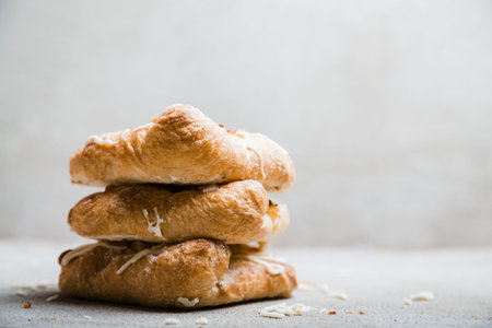 Sweet bun with cottage cheese and apple jam on rustic grey background, copy space