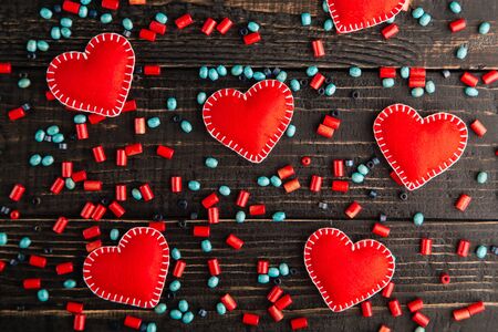 Red hearts from felt on the tableの写真素材