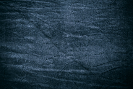 Texture of dark blue crumpled fabricの写真素材