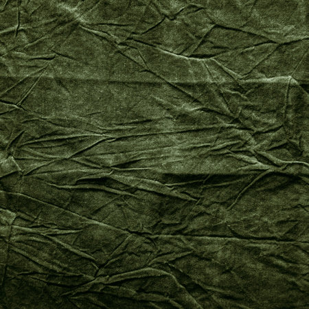 Texture of dark khaki crumpled fabricの写真素材