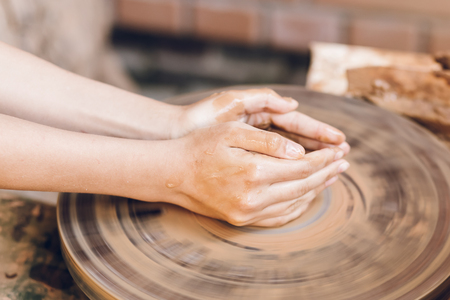 Child learning clay modelingの写真素材