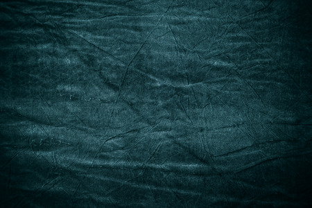 Texture of dark blue crumpled fabricの写真素材