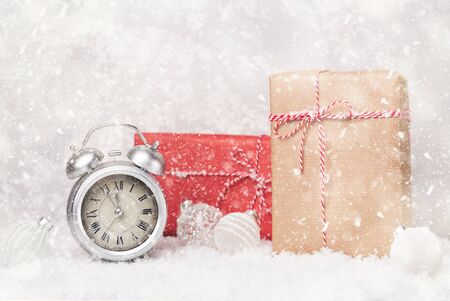 Xmas background with craft gifts and alarm clock, christmas preparations, copy spaceの写真素材