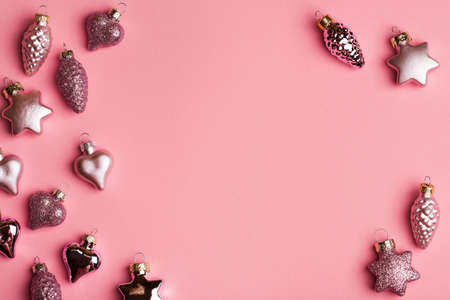 New Year creative composition, Christmas toys on pink background. Top view, copy spaceの写真素材