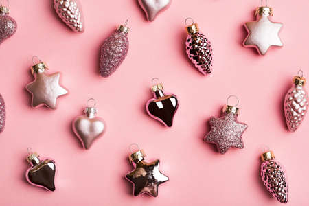 New Year creative composition, Christmas toys on pink background. Top view, copy spaceの写真素材