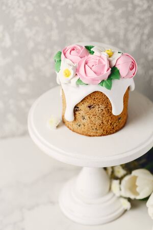 Easter homemade cake with marzipan decorations on marble table. Holiday concept, copy spaceの写真素材