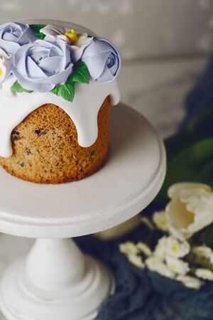 Easter cake on the stand on grey background. Holiday background, copy spaceの写真素材