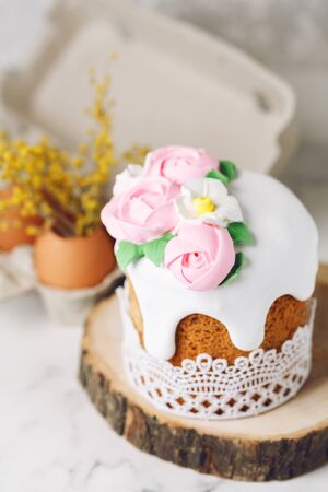 Easter rustic composition. Yellow flowers in eggs. Holiday background. Copy spaceの写真素材