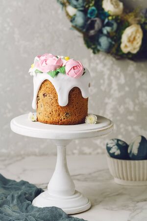 Easter cake on the stand on grey background. Holiday background, copy spaceの写真素材