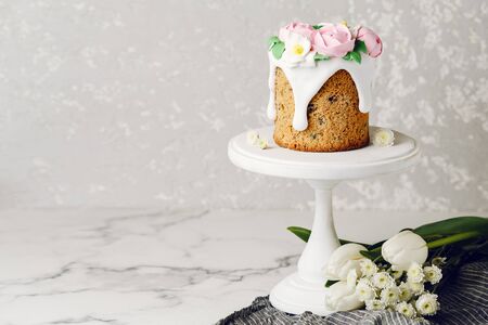 Easter cake on the stand on grey background. Holiday background, copy spaceの写真素材