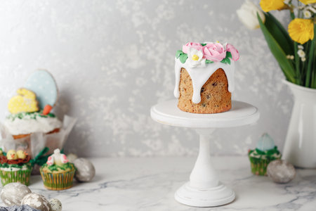 Easter cake on the stand on grey table. Holiday background, copy space