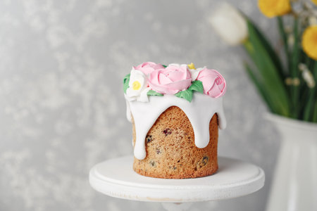 Easter cake on the stand on grey table. Holiday background, copy space