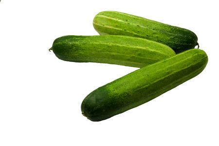 fresh cucumbers isolated on whiteの写真素材