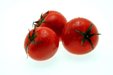 Tomatoes isolated on whiteの写真素材