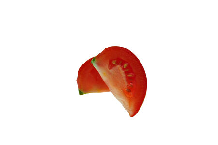 slice of tomato isolated on whiteの写真素材